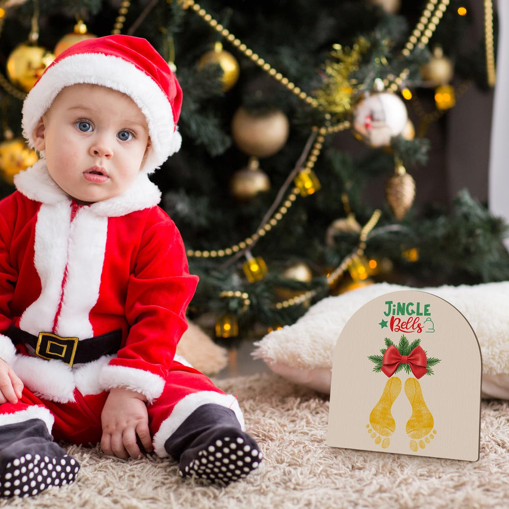 Beeveer Baby's First Footprint Art nursery decor adds warm holiday ambiance