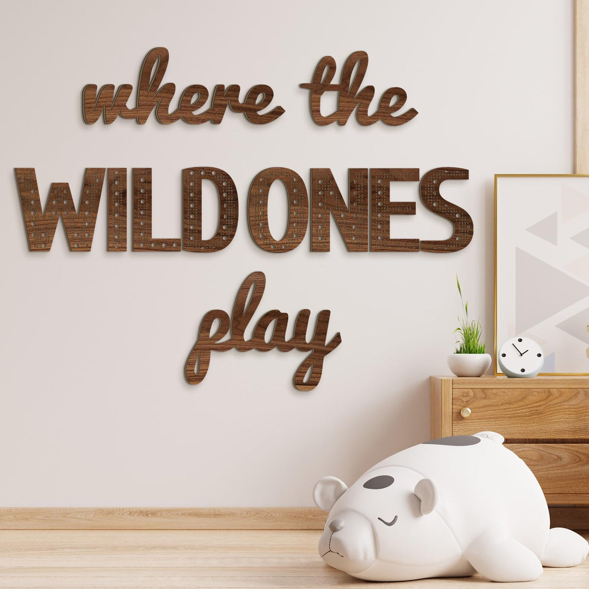 Beeveer Where the Wild Ones Play sign close-up in brown wood finish for a cozy playroom.