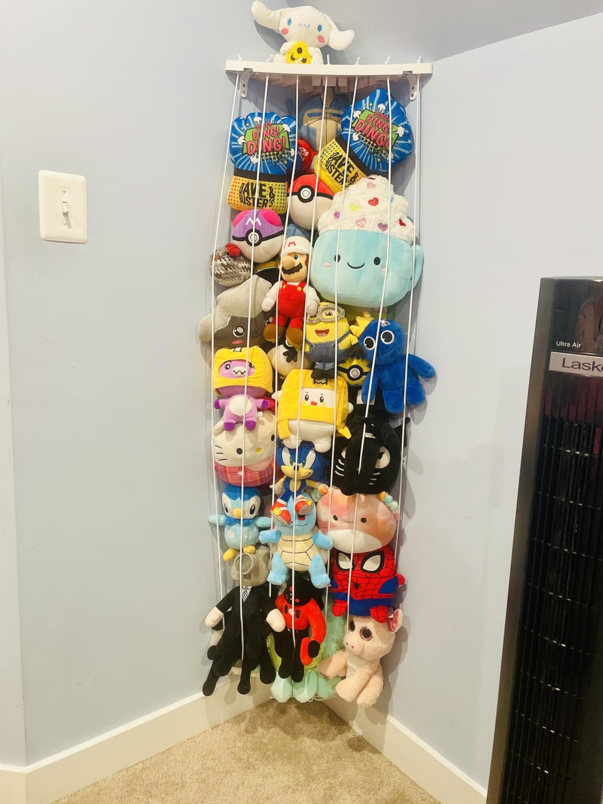 Befayoo organized kid’s room with wall-mounted plush storage.