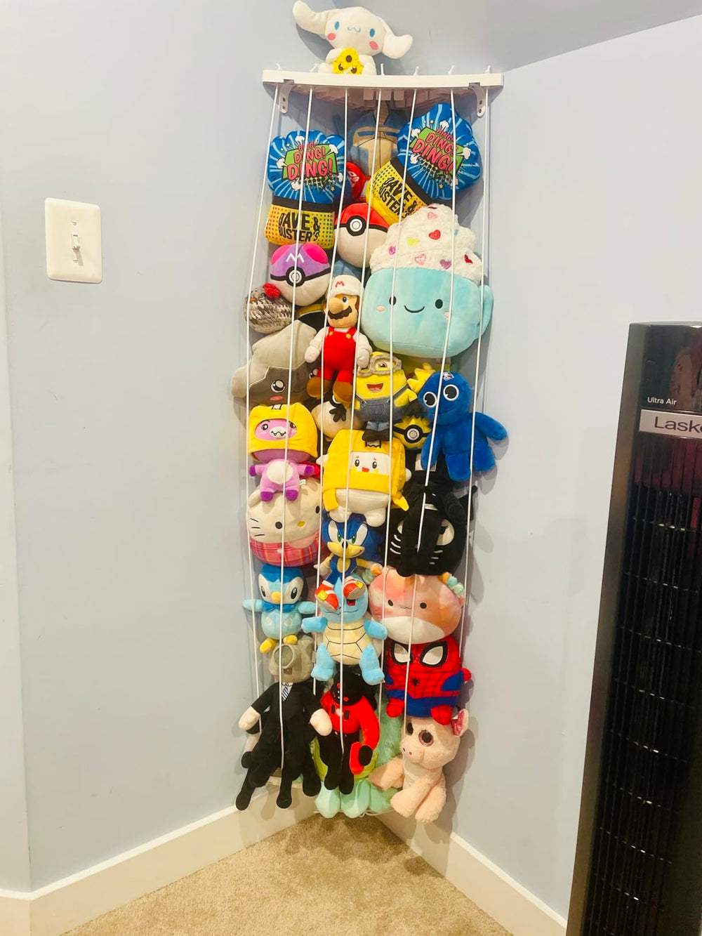 Befayoo organized kid’s room with wall-mounted plush storage.