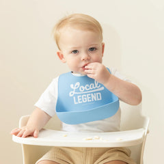 Bella Tunno baby bib showing deep-pocket catching drips and spills.