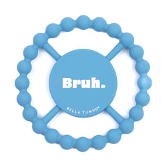 Bella Tunno Bruh teether held by baby shows easy grip for tiny hands and natural soothing.