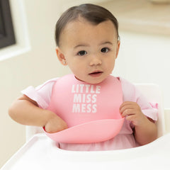 Bella Tunno Little Miss Mess bib pocket open catching drips during feeding.