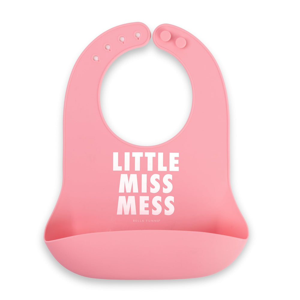 Bella Tunno Little Miss Mess bib on table catching crumbs for mess-free meals.