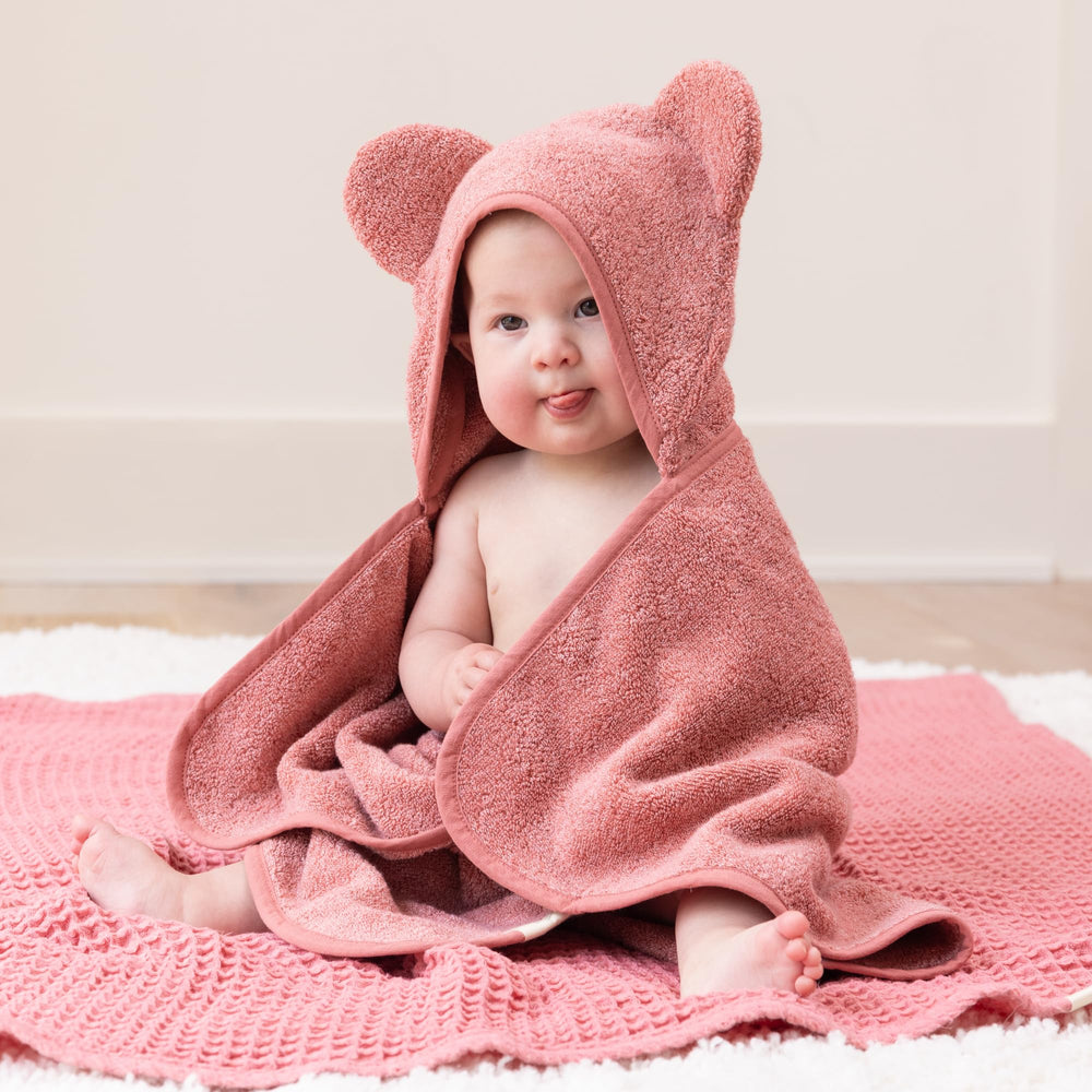 Bella Tunno Watermelon hooded towel on baby after bath keeps little one warm and cozy.