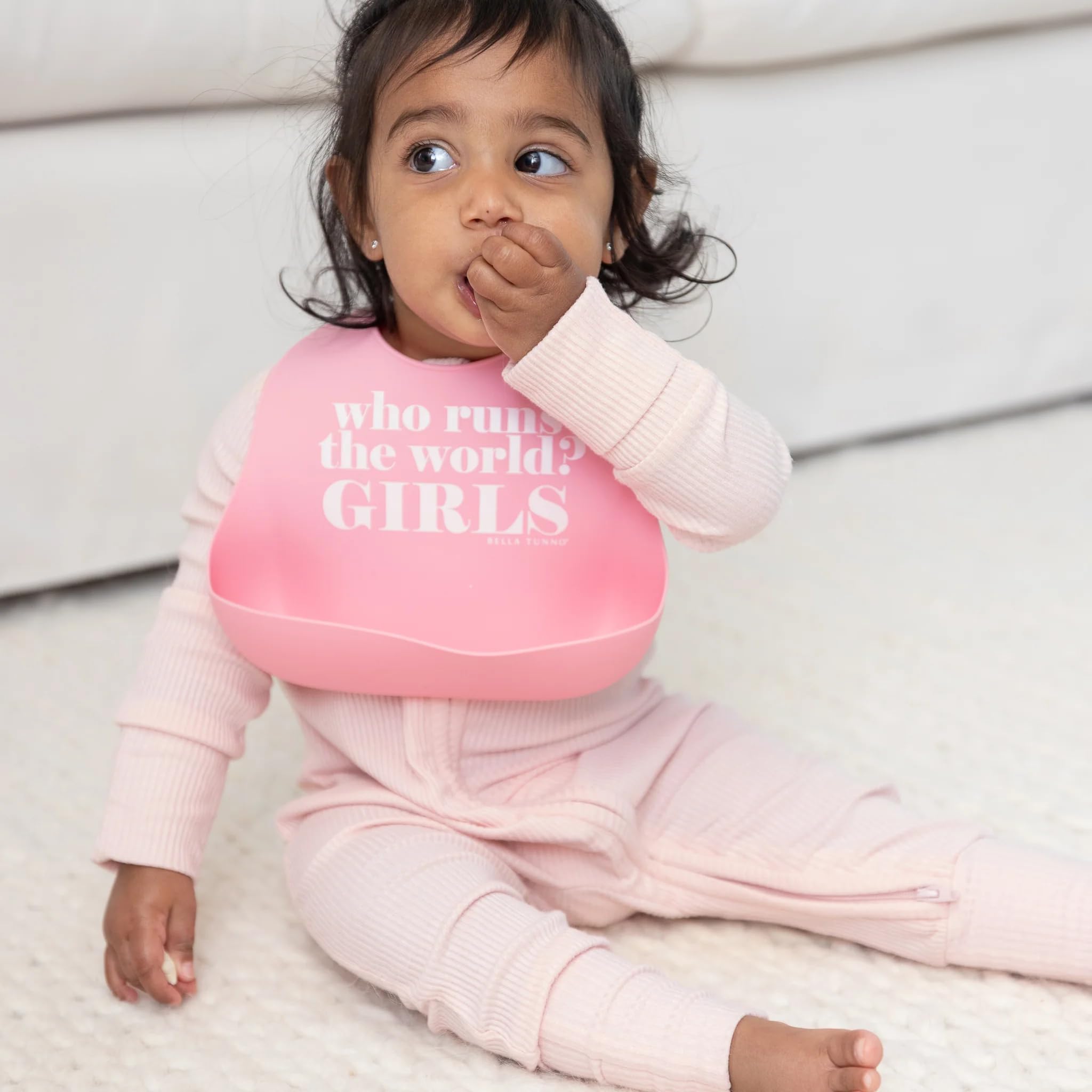 Bella Tunno Who Runs The World bib deep catcher trapping drips to keep outfits clean.