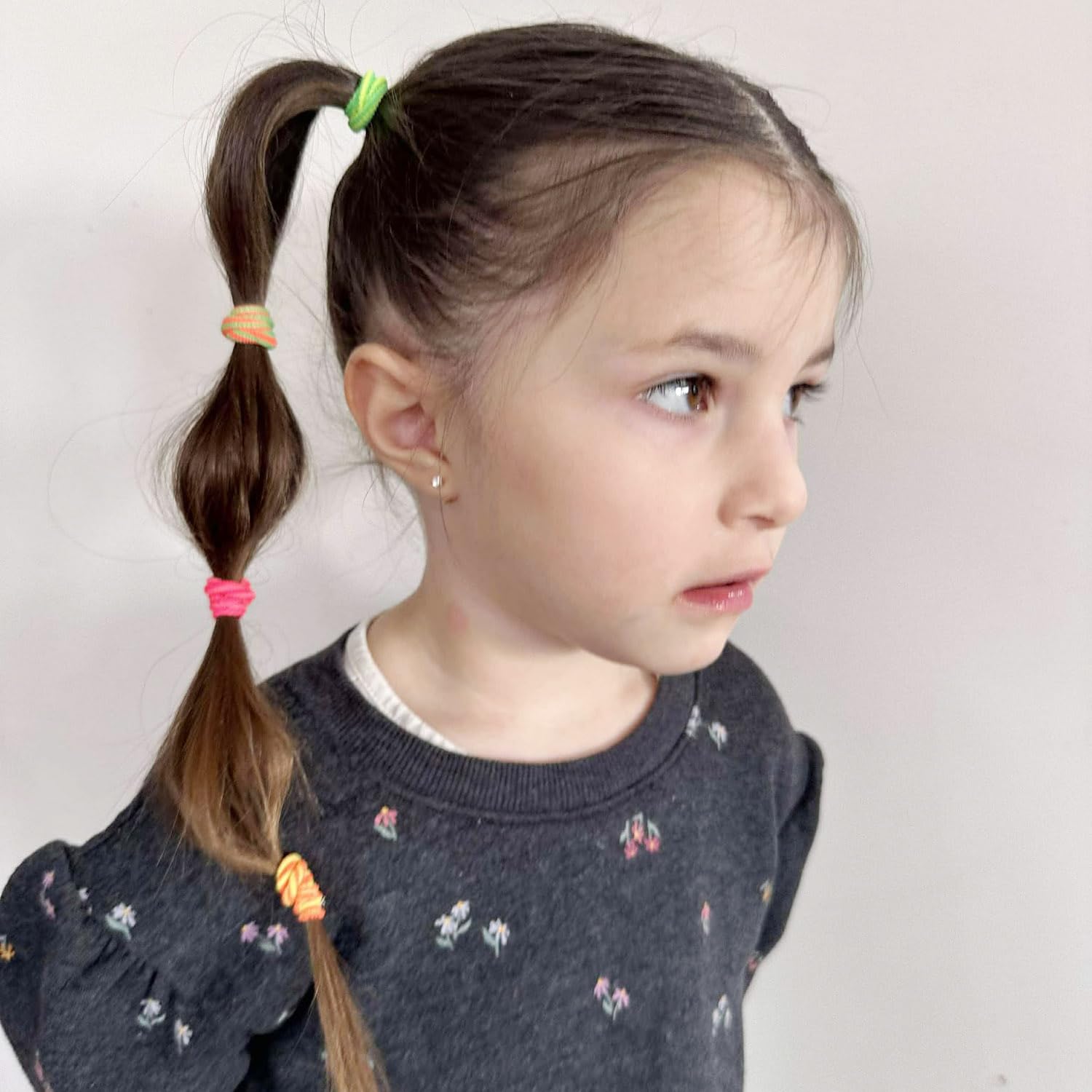 BEoffer hair ties closeup shows striped colors and soft elastic for everyday styling.