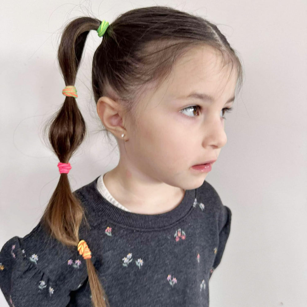 BEoffer hair ties closeup shows striped colors and soft elastic for everyday styling.