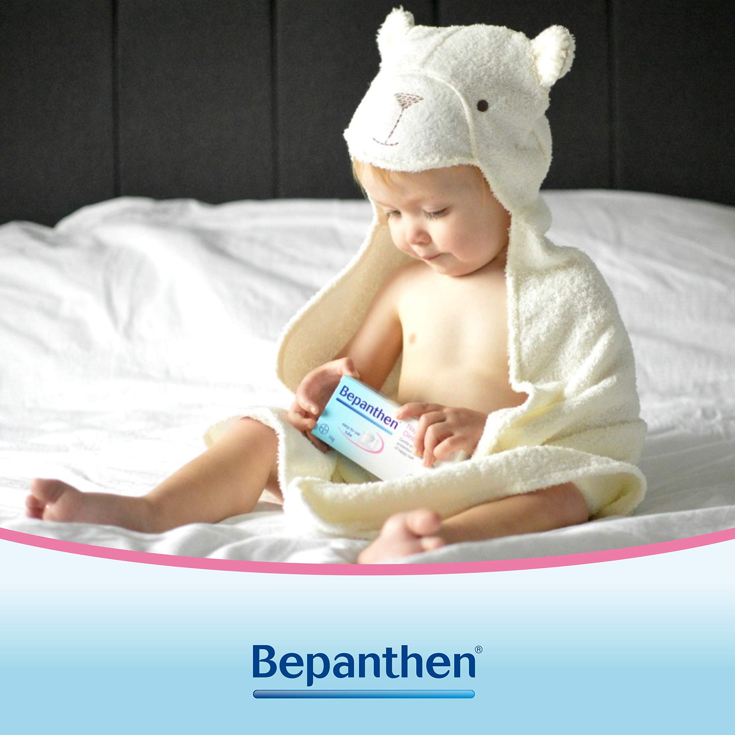 Bepanthen tube dispensing a small amount for easy diaper changes.