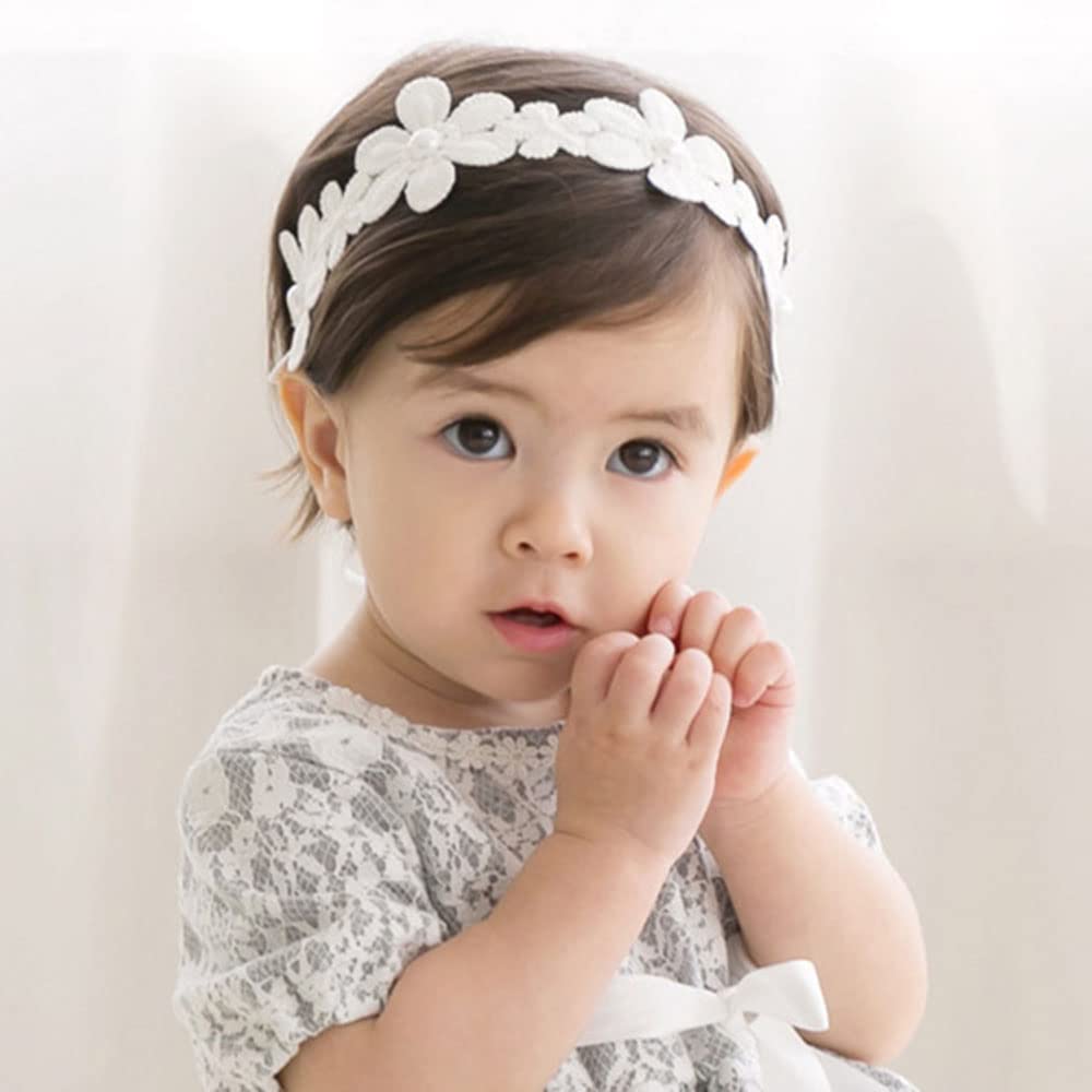 Bethynas baby bow headband, soft lace floral front, comfortable newborn accessory.