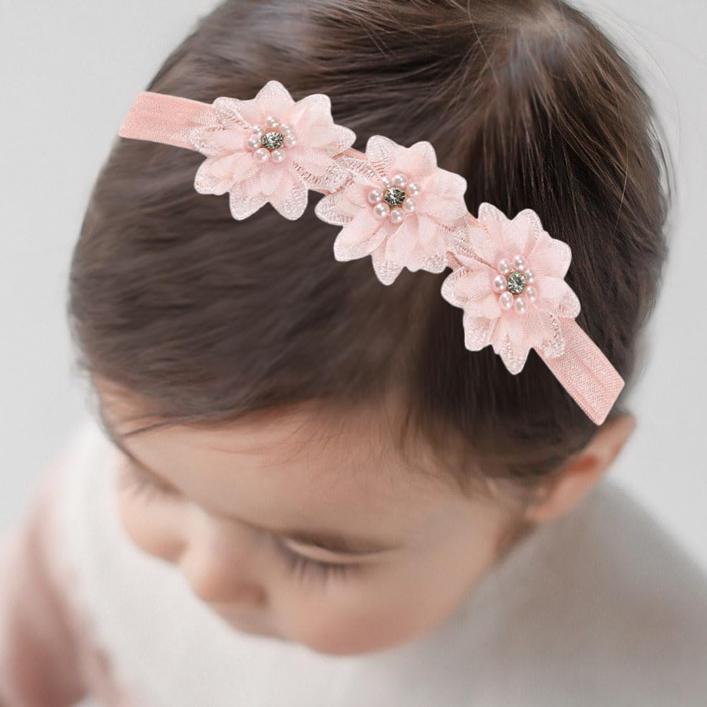 Bethynas elastic headband pink keeps baby comfortable without slipping.