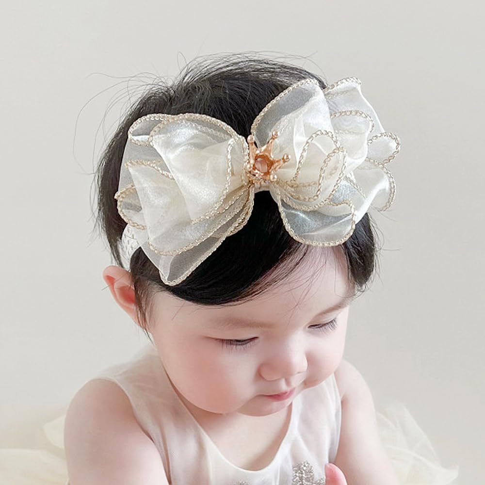 Bethynas Princess Crown Lace Bowknot Headband worn on baby girl at a birthday party moment