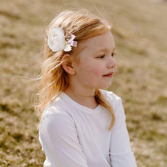 BFNAAgirl flower hair clip with secure alligator clip stays put.