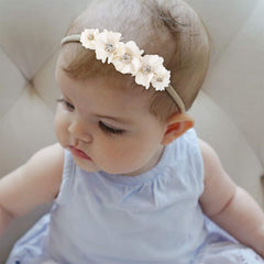 BFNAAgirl flower headbands with rhinestones and pearls add subtle sparkle for occasions