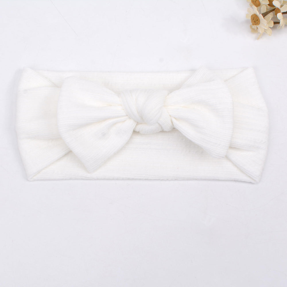 BIANHUAN baby headband on dresser display soft and adorable.