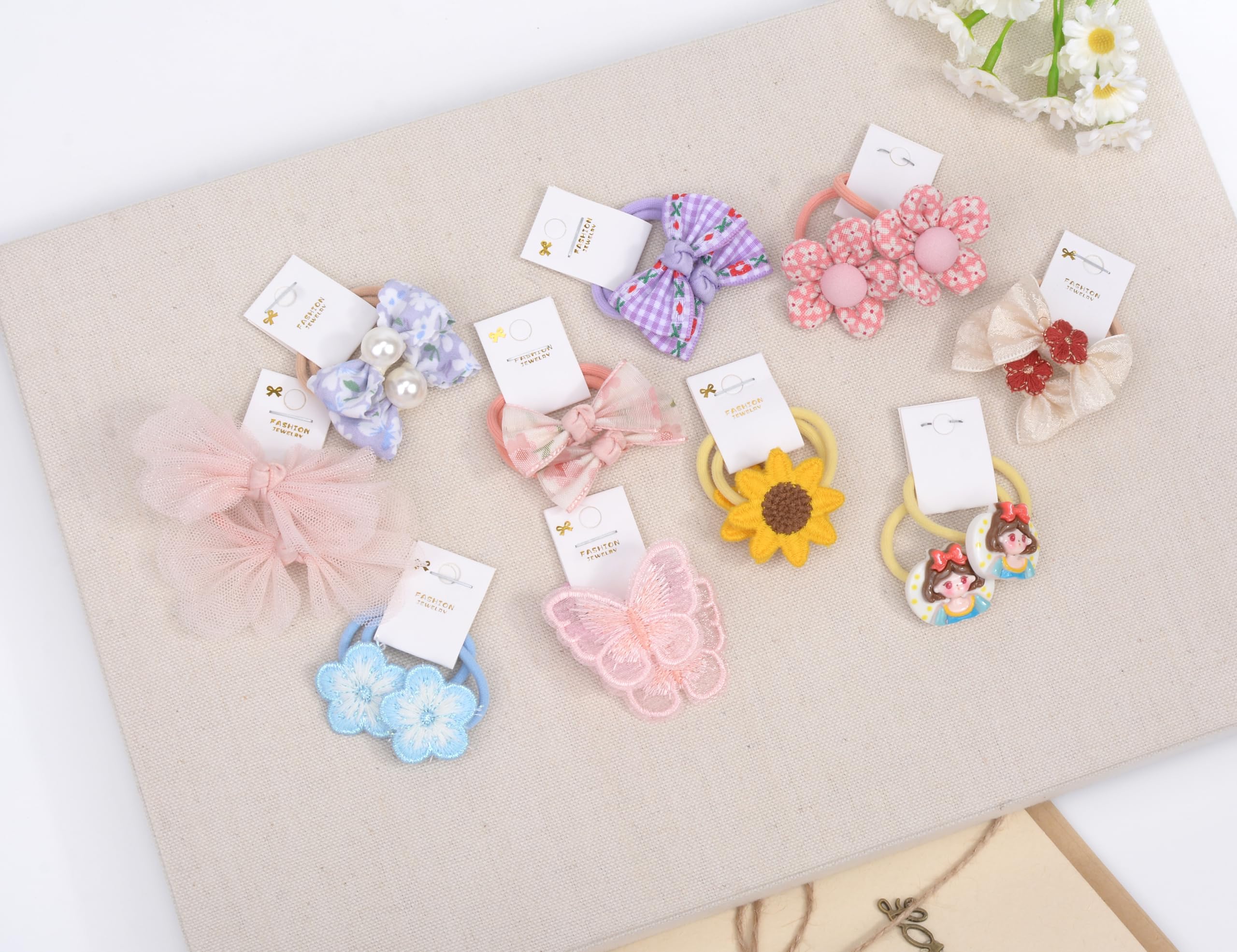 BIANHUAN baby hair ties close-up showing colorful bows and soft elastic