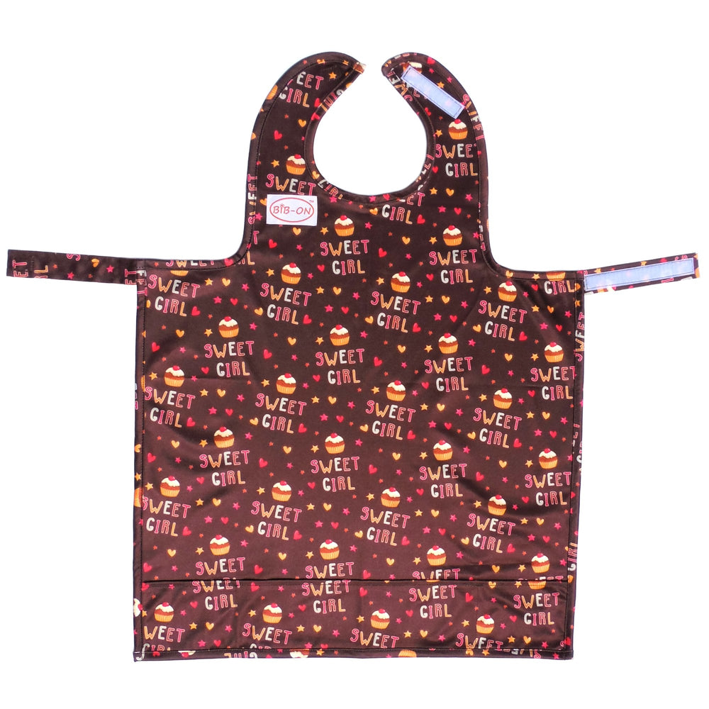 BIB-ON full-coverage bib cupcakes front view shows spill protection for ages 0-4.
