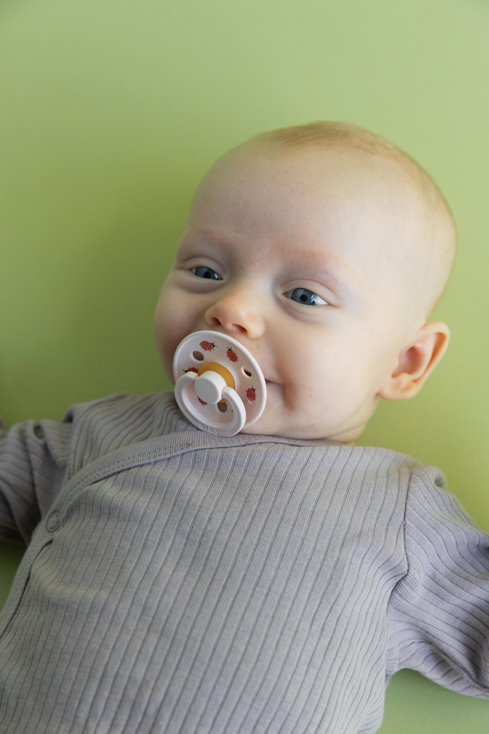 BIBS Studio Soother baby-use during feeding image suggests calm moments for infants.