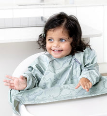 BIBaDO long sleeve bib fits a wide highchair tray for mess-free feeding.