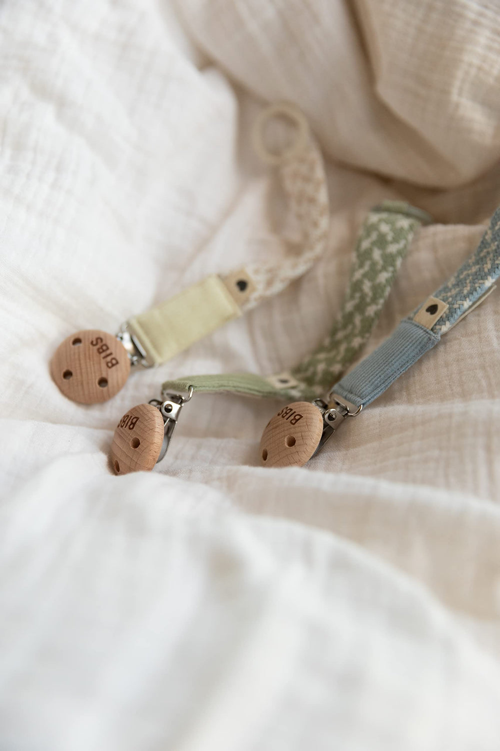 BIBS Paci Braid pacifier clip demonstrates secure attachment for everyday use.