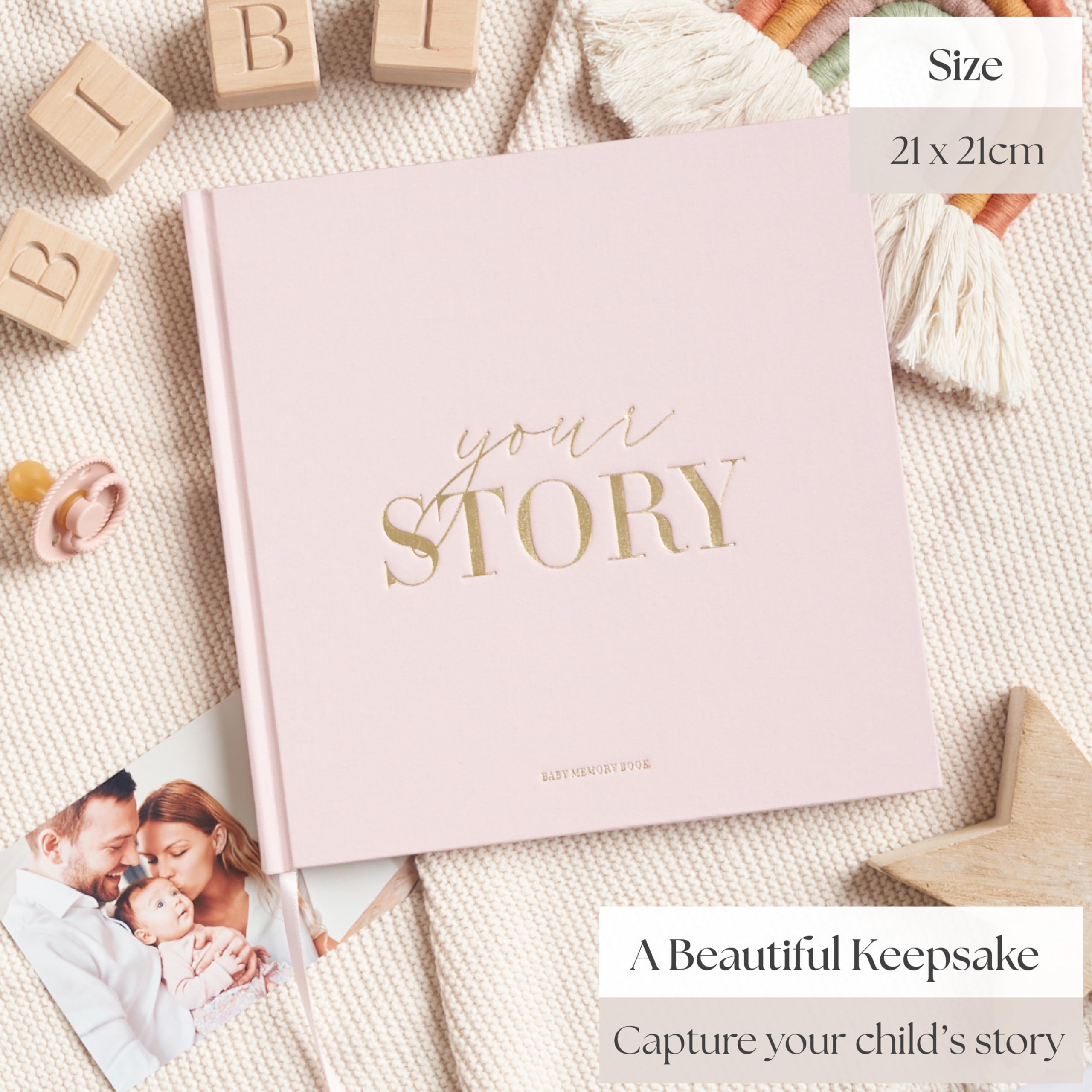 Close-up of Bibi & Beau memory book gold-foil cover, luxurious heirloom-quality detailing.