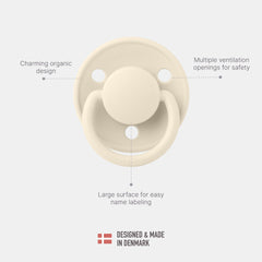 BIBS De Lux round nipple focus showcases comfortable latch for newborns up to 6 months.