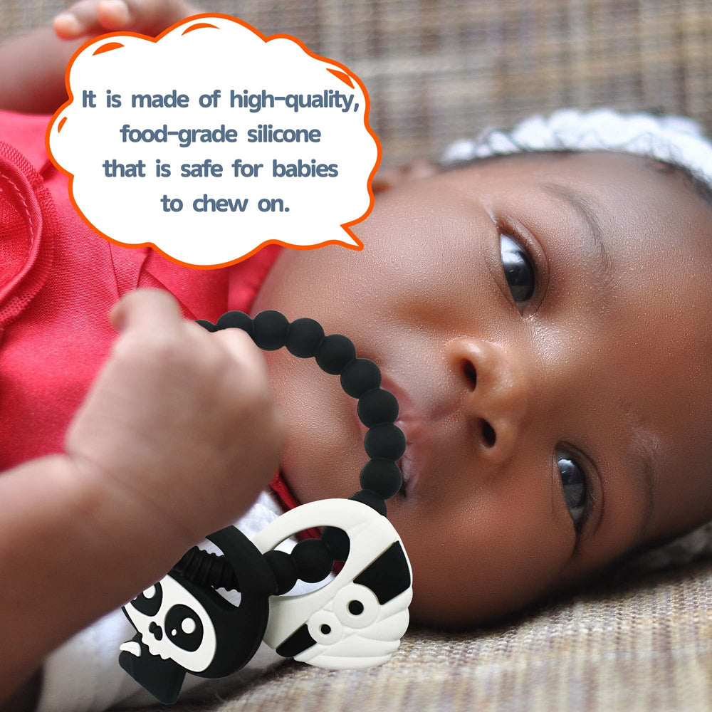 BIGSPINACH teether texture close-up emphasizes soft silicone and chew-friendly ridges