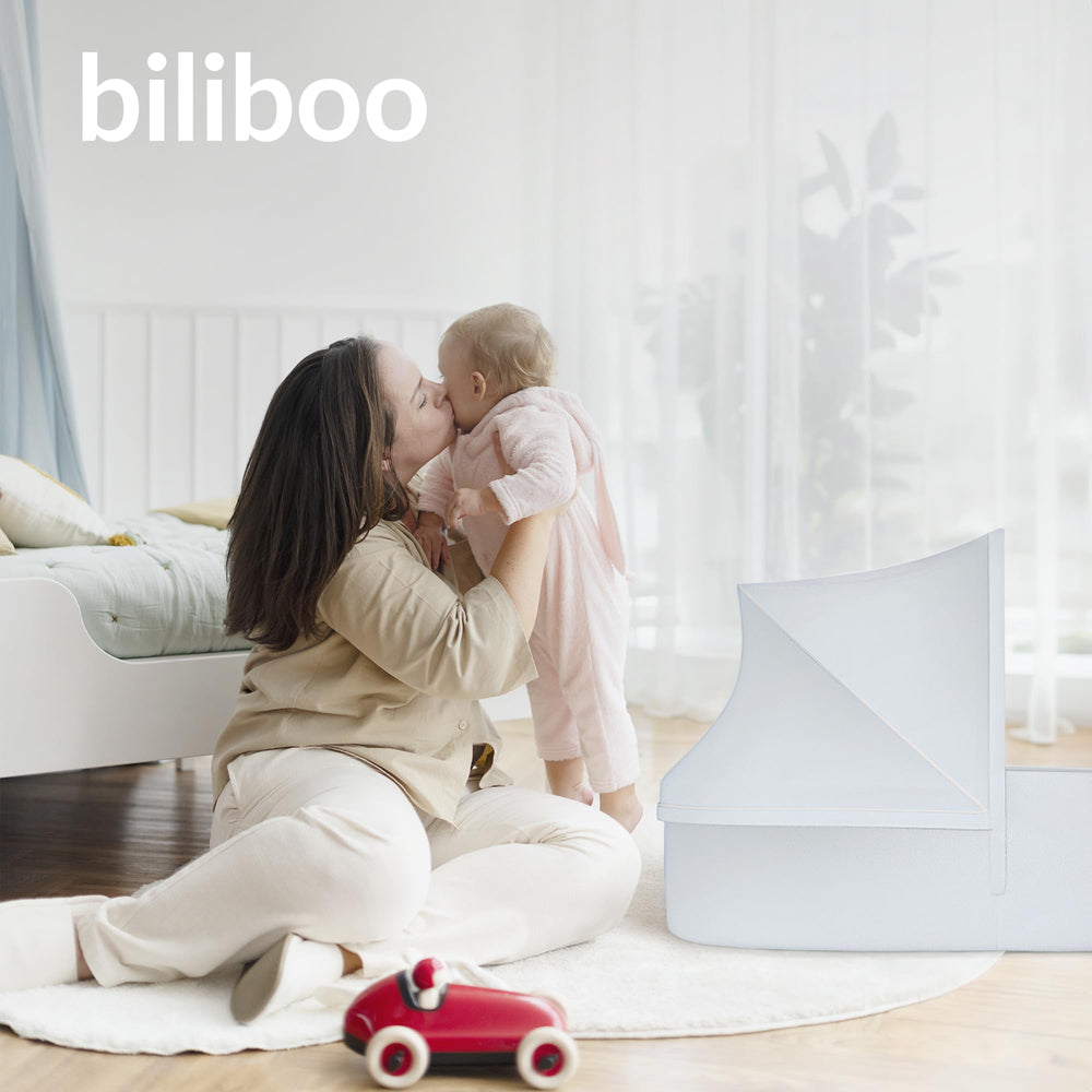 Biliboo premium portable baby lounger in cream adds stylish, functional rest space.