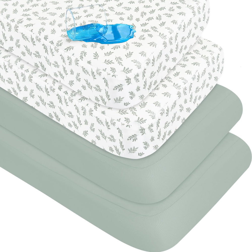 Biloban crib sheets folded with green leaf design for a snug fit