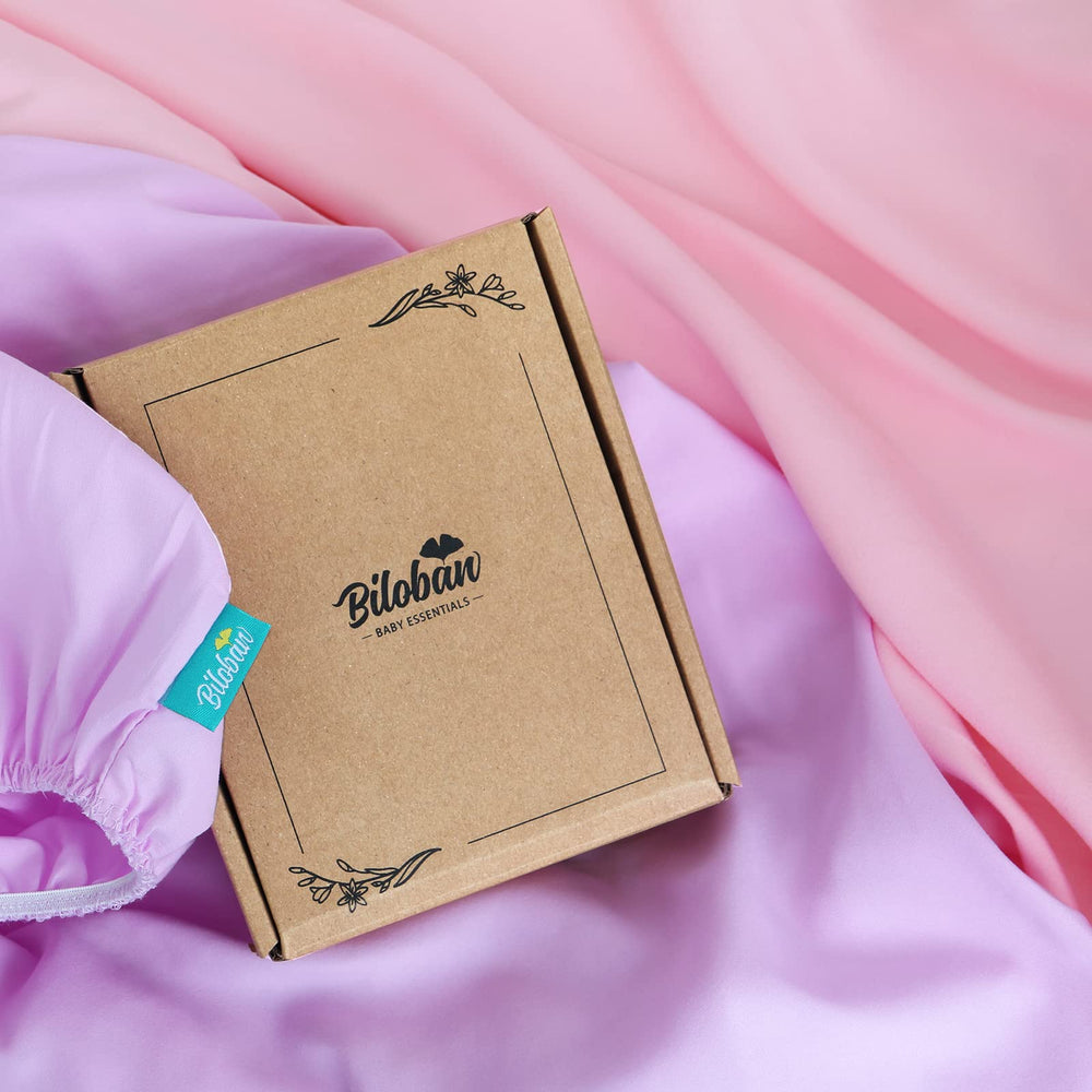 Biloban baby bassinet sheets fitted on mattress demonstrates secure fit for active sleepers.