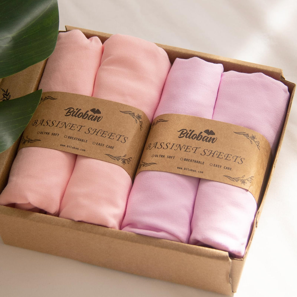 Biloban baby bassinet sheets packaging highlights gift-ready set for new parents.
