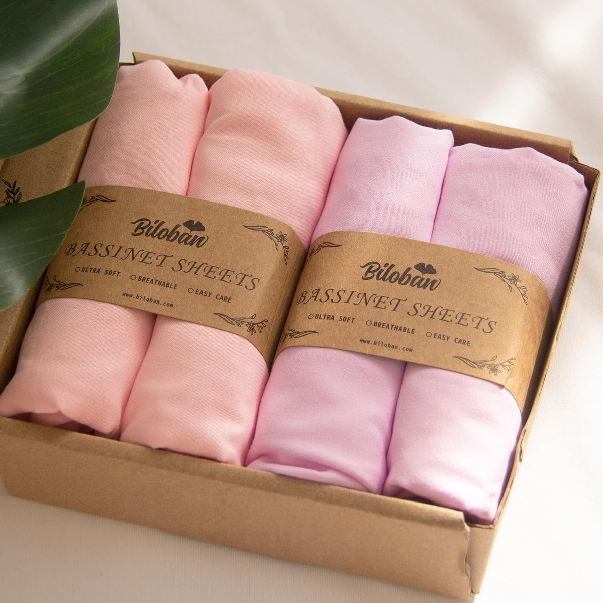Biloban baby bassinet sheets packaging highlights gift-ready set for new parents.