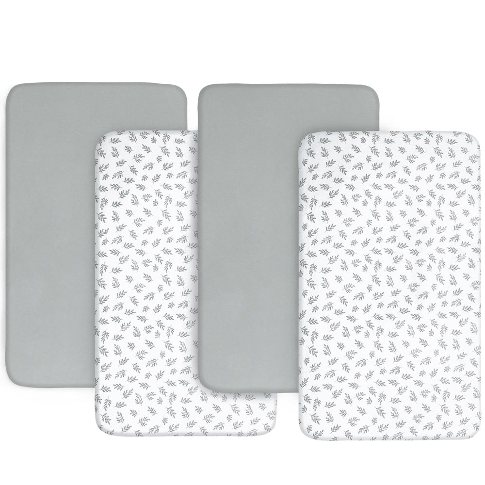 Biloban baby bassinet sheets in gray and white highlight edge-encased fit for secure, all-night use.