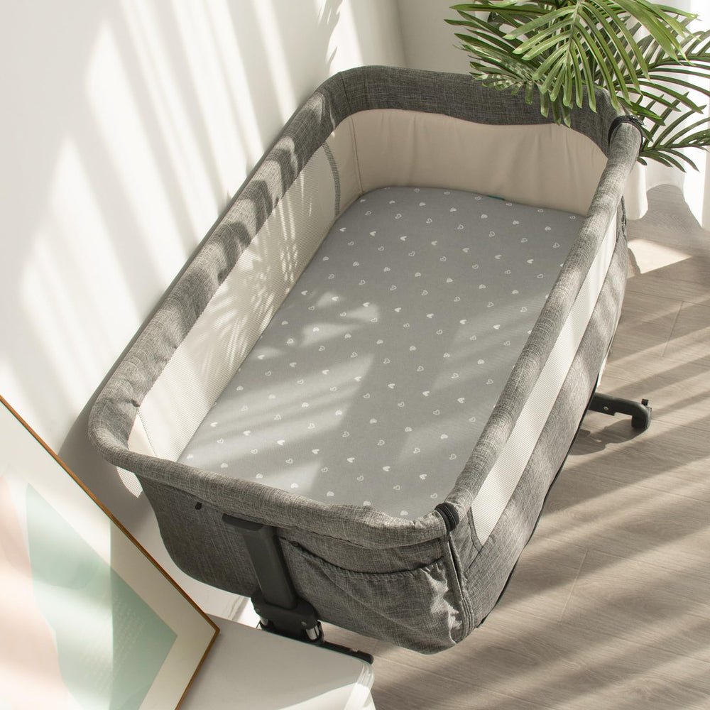 Biloban bassinet pad design with rounded corners and edge support