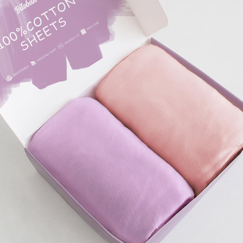 Biloban bassinet sheets pink and violet 2-pack showing soft cotton surface for baby comfort