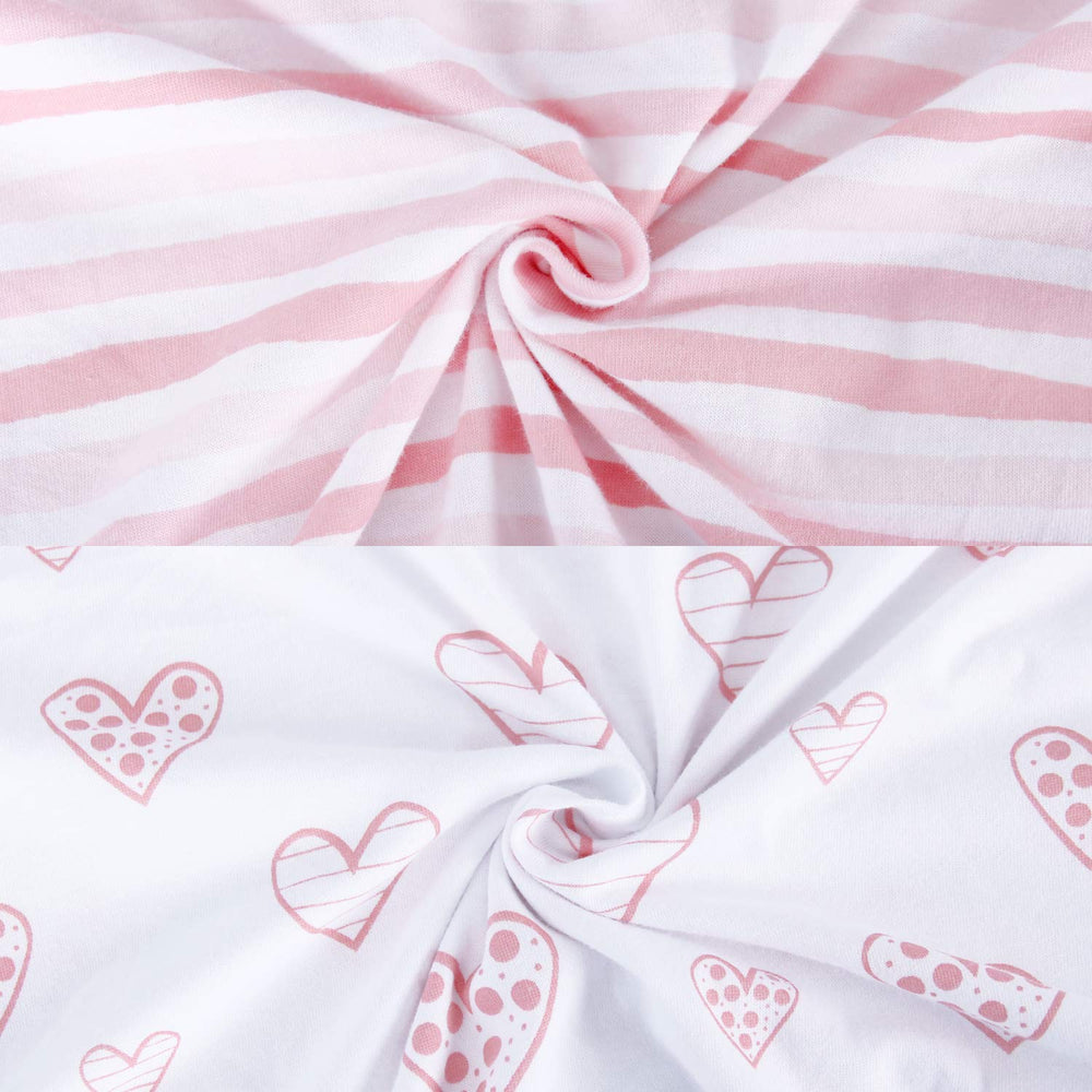 Biloban bassinet sheets pink elastic edge demonstrates secure fit along the bottom