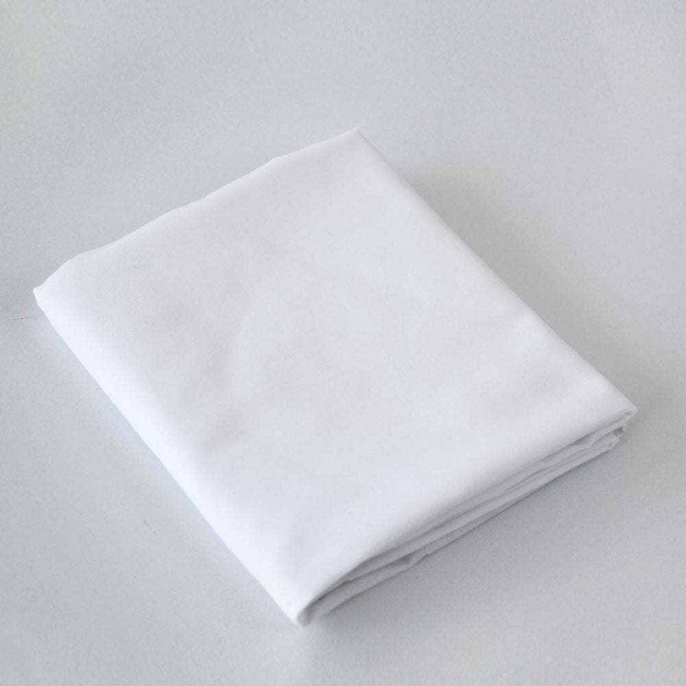 Biloban two-pack white cot sheets support consistent naptime bedding across rooms.