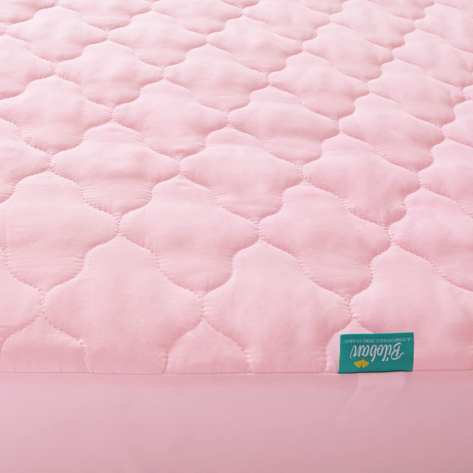 Biloban crib mattress protector noiseless design ensures quiet naps for baby.