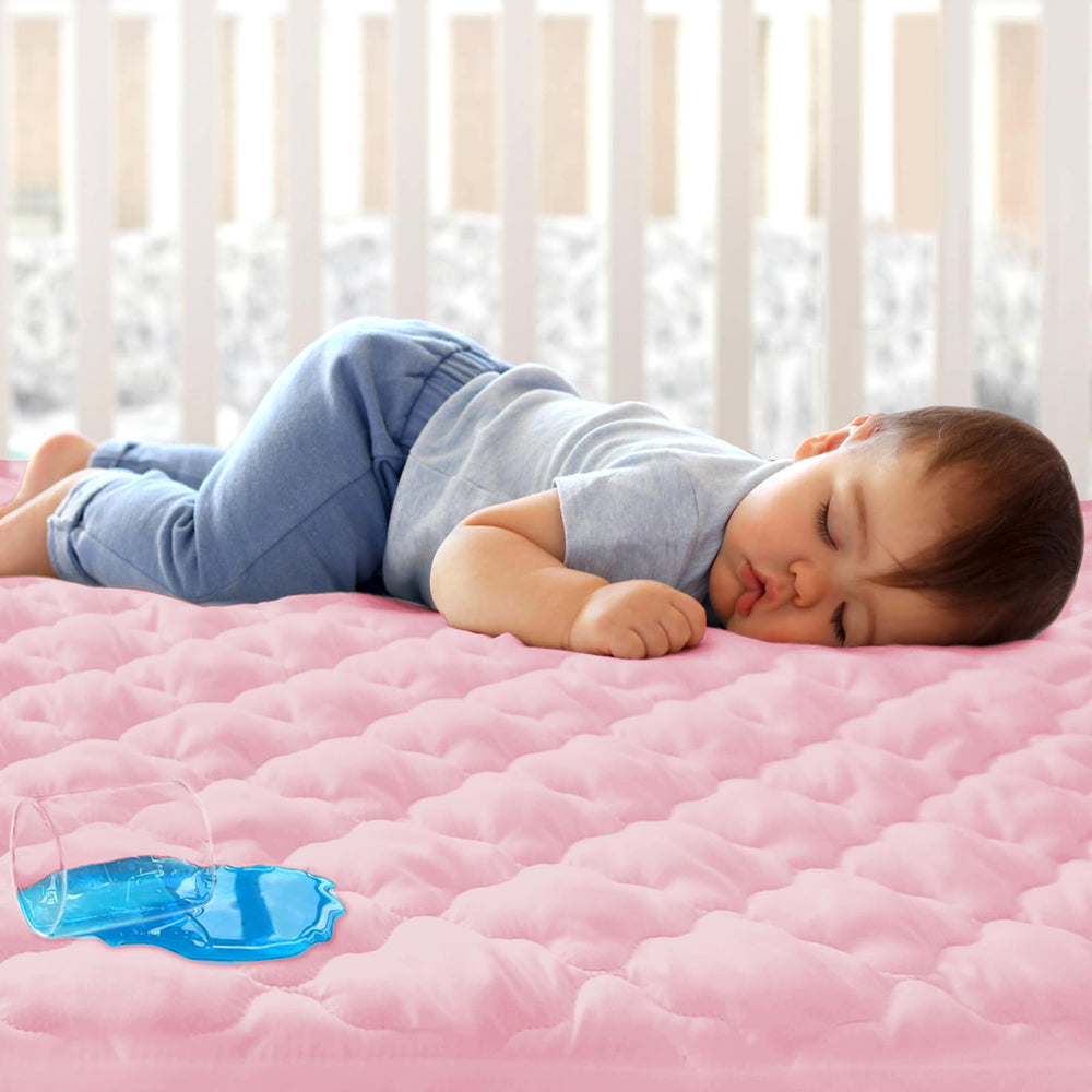 Biloban crib mattress protector pink packaging shows durable water resistance for nursery prep.