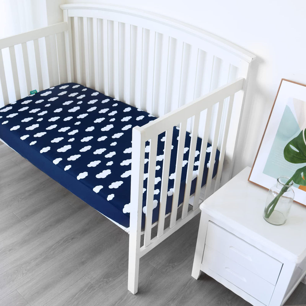 Biloban crib sheets with elastic band provide a snug fit for safe, flat sleeping surfaces