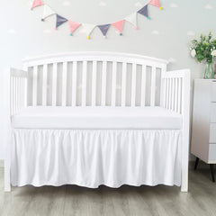 Biloban crib skirt 28x52 inches with 14-inch drop conceals under-bed storage neatly.