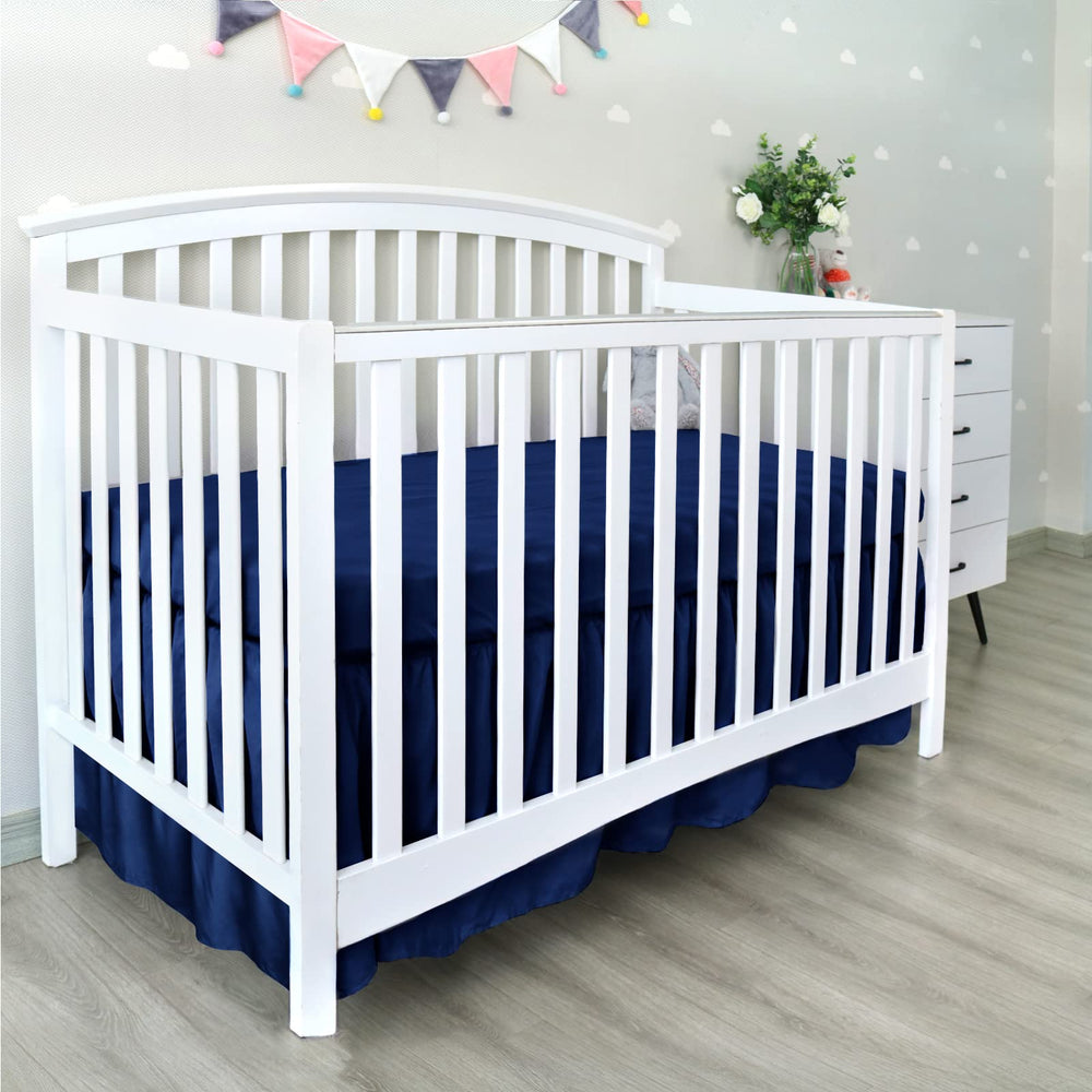 Biloban navy crib skirt care and folding for storage