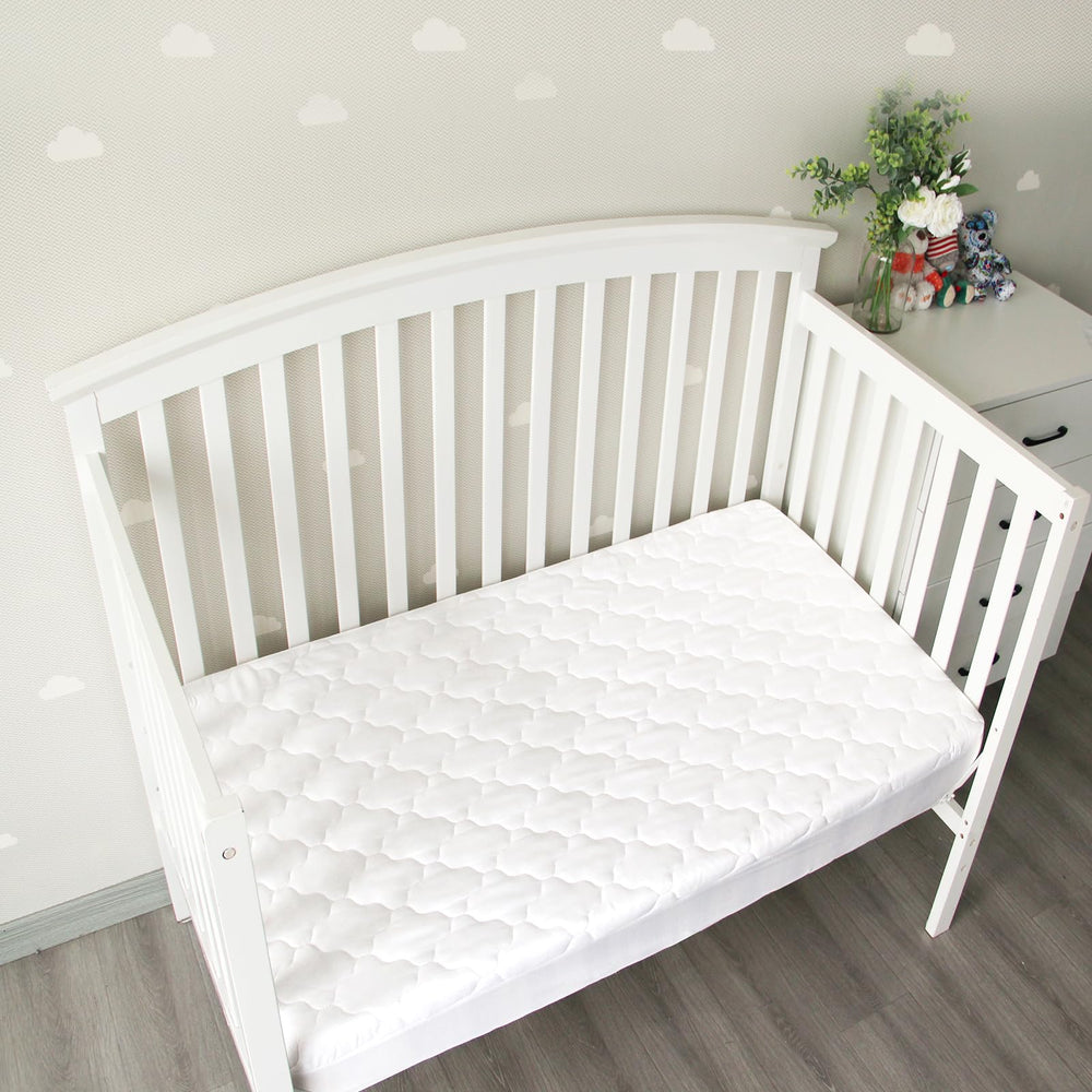 Biloban machine-washable mattress protector designed for easy nursery care