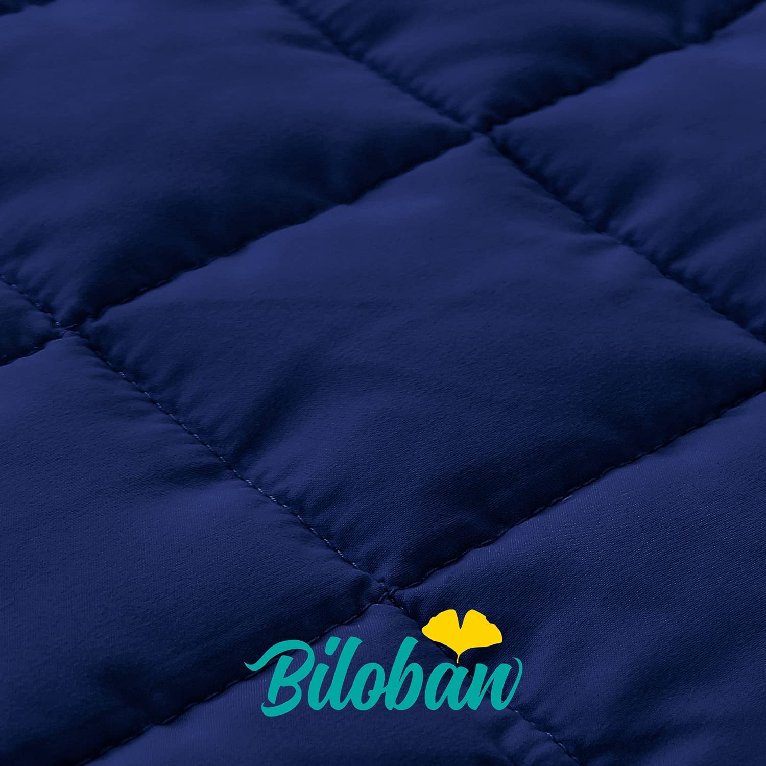 Biloban nap mat dark blue quilted fabric close-up demonstrates durability.