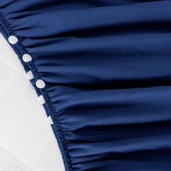 Biloban adjustable-fit navy crib skirt eases installation