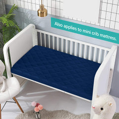 Biloban pack-and-play mattress pad gray-navy folded demonstrates easy tuck-in fit for quick setup.
