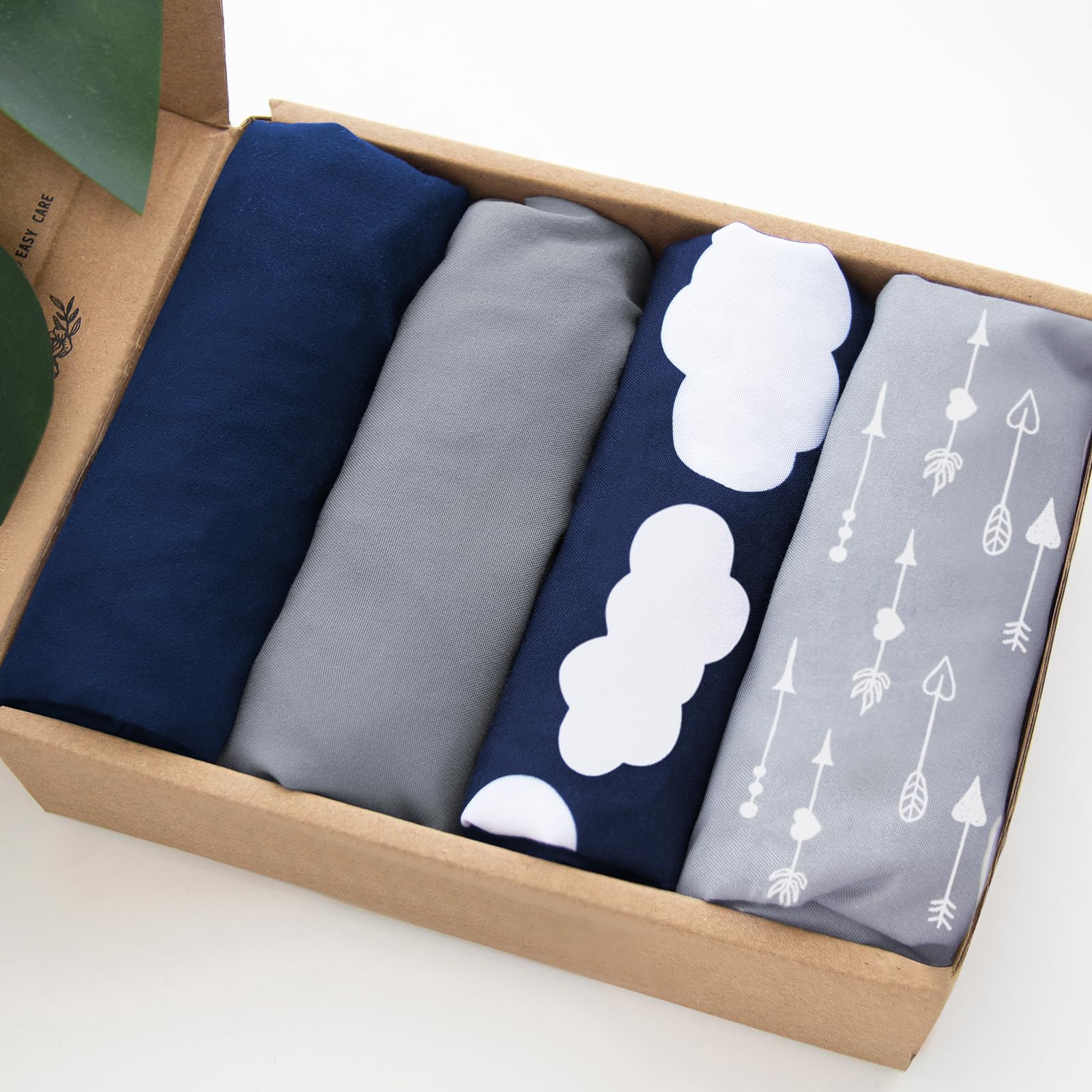 Biloban navy cloud pack-n-play sheet folded for easy storage and quick swap
