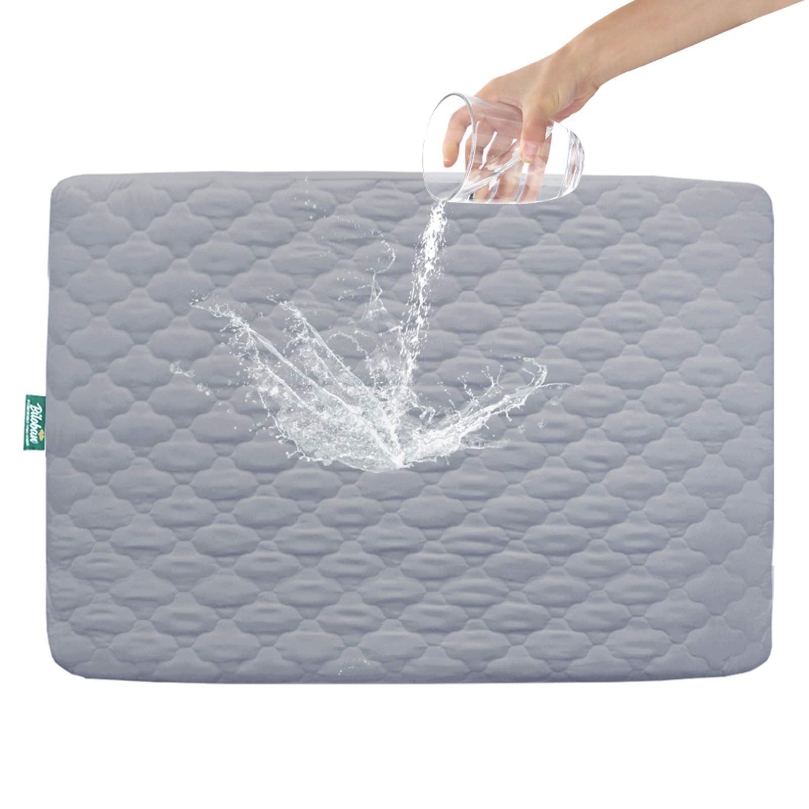Biloban pack-n-play mattress protector gray folded, showing soft quilted surface for comfortable naps.