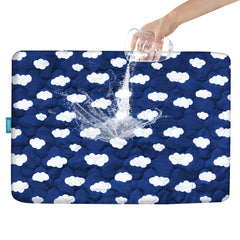 Biloban Pack N Play Mattress Protector Navy Cloud neatly folded for quick setup and playtime comfort.