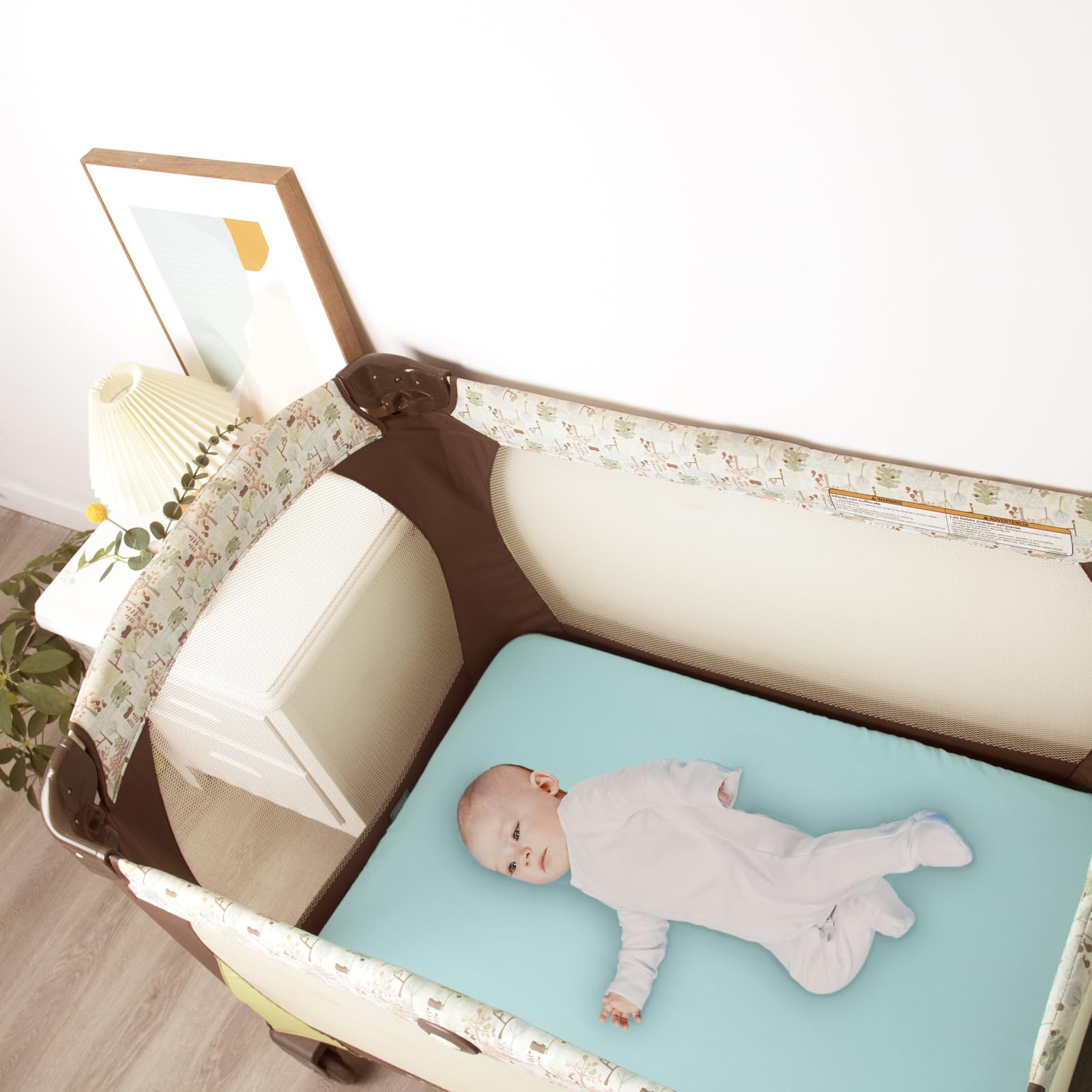 Biloban two-pack pink and aqua pack and play sheets ready for nursery coordination.